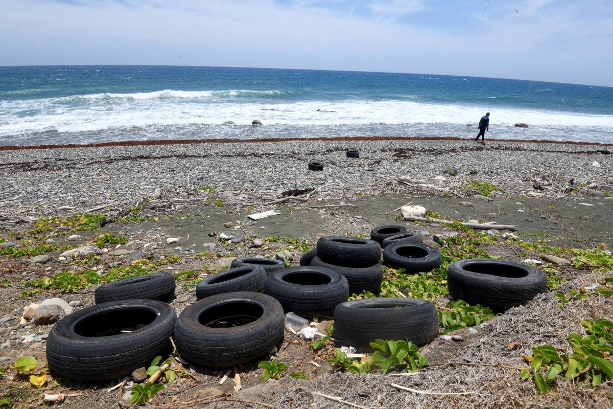 Discarded tyres litter a section of the South Haven public beach in St Thomas.