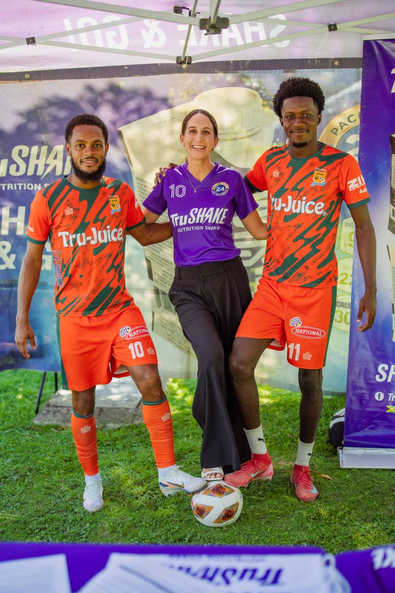 Lauren Mahfood (centre), marketing manager, Trade Winds Citrus Limited, pauses for a photo with TruSHAKE’s newest brand ambassadors, Tru-Juice FC footballers Alex Marshall (left) and Daniel Roberts (right), following the formalisation of their partnershi