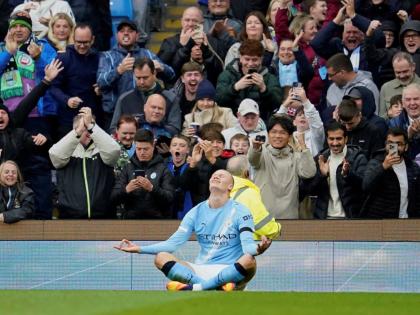 Manchester City's Erling Haaland celebrates after scoring during the Premier League football match between Manchester City and Manchester United in Manchester, England on September 14, 2025. 