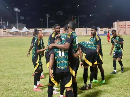 Jamaica’s Reggae Boyz celebrate Nickalia Fuller’s lone strike in an international friendly against Grenada at the Kirani James Stadium in St George’s on Sunday.