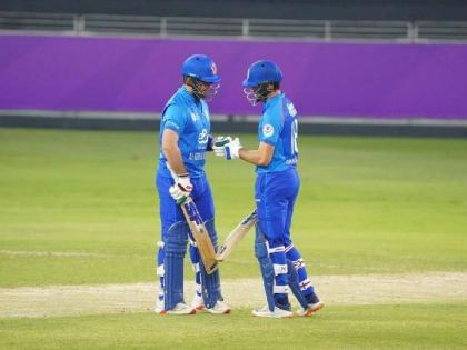 Afghanistan batsmen Ibrahim Zadran and Darwish Rasooli meet midpitch to discuss tactics on their way to a 132-run partnership in their T20I series opener against the West Indies in Dubai yesterday.