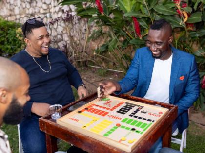 It was an evening of good vibes, great energy, and genuine connection as Mark McKenzie (right), SME relationship manager, JMMB Bank; Earl McDonald of VL BPO Limited, and Jordan Wright (left) of SJOJ Limited, enjoy a game of Ludo.
