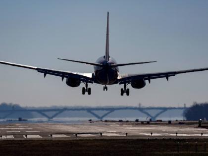 A plane lands at Ronald Reagan Washington National Airport in Arlington, Virginia.