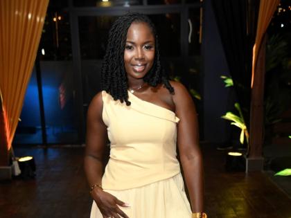 Business owner Shanell Montgomery opts for a yellow one-shoulder mini dress with a ruffled hem from Devine Pieces.