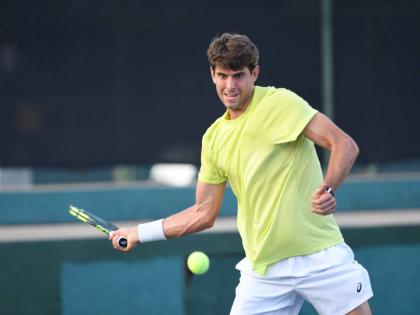Blaise Bicknell prepares a forearm return during a Kingston Open tennis match on August 18 at Liguanea Club in New Kingston.