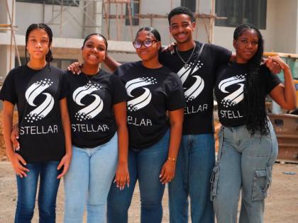 Romulus Deenah (second right) is flanked by Mount Alvernia High School students participating in the Stellar Foundation programme (from left), Bethany Davis, Tiffany Banner, Kiyoshi Robinson and Rajhni Raxton, during a visit to the One Reading construction