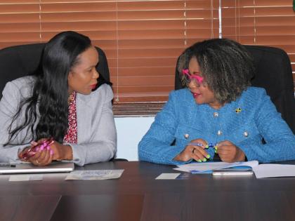 Senator Dr Dana Morris Dixon (right), minister of education, skills, youth and information; and Dr Kasan Troupe, permanent secretary in the ministry.