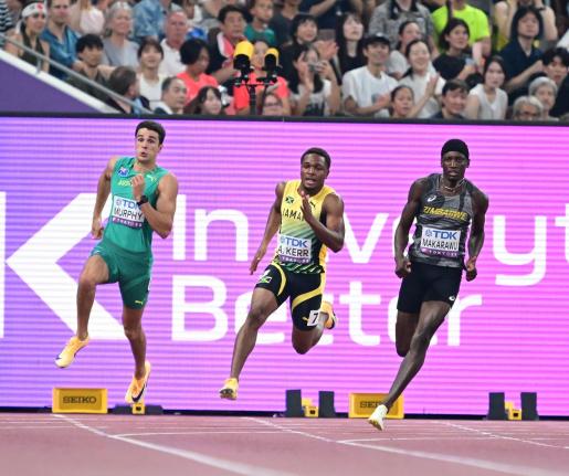 Jamaica’s Adrian Kerr (centre) competes in heat two of the men’s 200 metres qualification round at the World Athletics Championships in Tokyo, Japan, yesterday. 