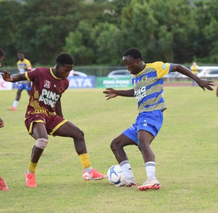 Maggotty High’s Roshane Lewis (left) challenges Rusea’s High’s Omarion Jemmison during their Group One daCosta Cup second-round match at the Montego Bay Sports Complex on Saturday, October 11, 2025.