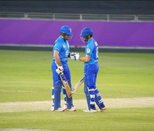 Afghanistan batsmen Ibrahim Zadran and Darwish Rasooli meet midpitch to discuss tactics on their way to a 132-run partnership in their T20I series opener against the West Indies in Dubai yesterday.