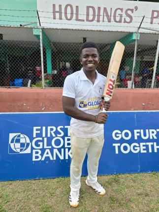 St Jago captain Vitel Lawes is all smiles after leading his side to the First Global Bank Grace Shield title in a game against Campion College at Melbourne Cricket Oval yesterday.