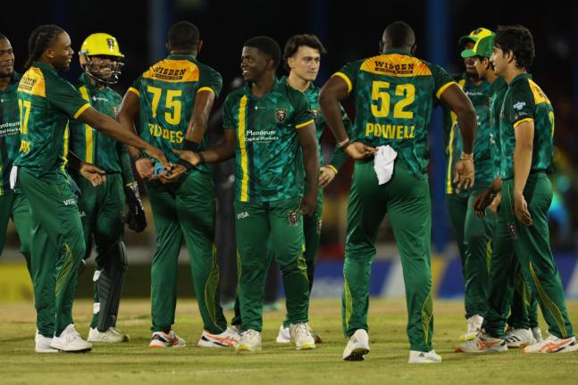 Jamaica Kingsmen players celebrate after their win against the Trinbago Knight Riders on Saturday night at the Queen’s Park Oval in Trinidad and Tobago.
