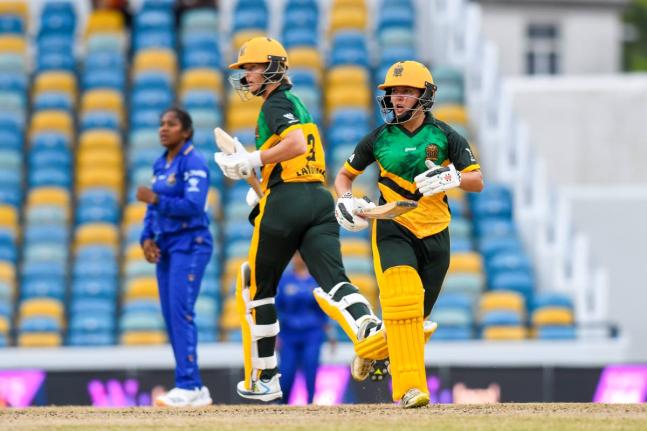 
Jamaica Empress’ Meg Lanning (centre) and Amy Hunter (right) go for a single during their Limacol Women’s Caribbean Premier League game against the Barbados Tridents at the Kensington Oval yesterday. Looking on is Tridents spinner, Afy Fletcher.